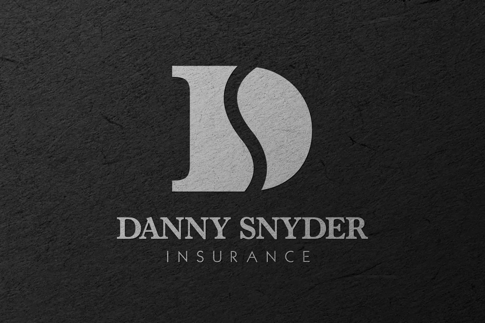 Danny Snyder Insurance Logo on black paper card