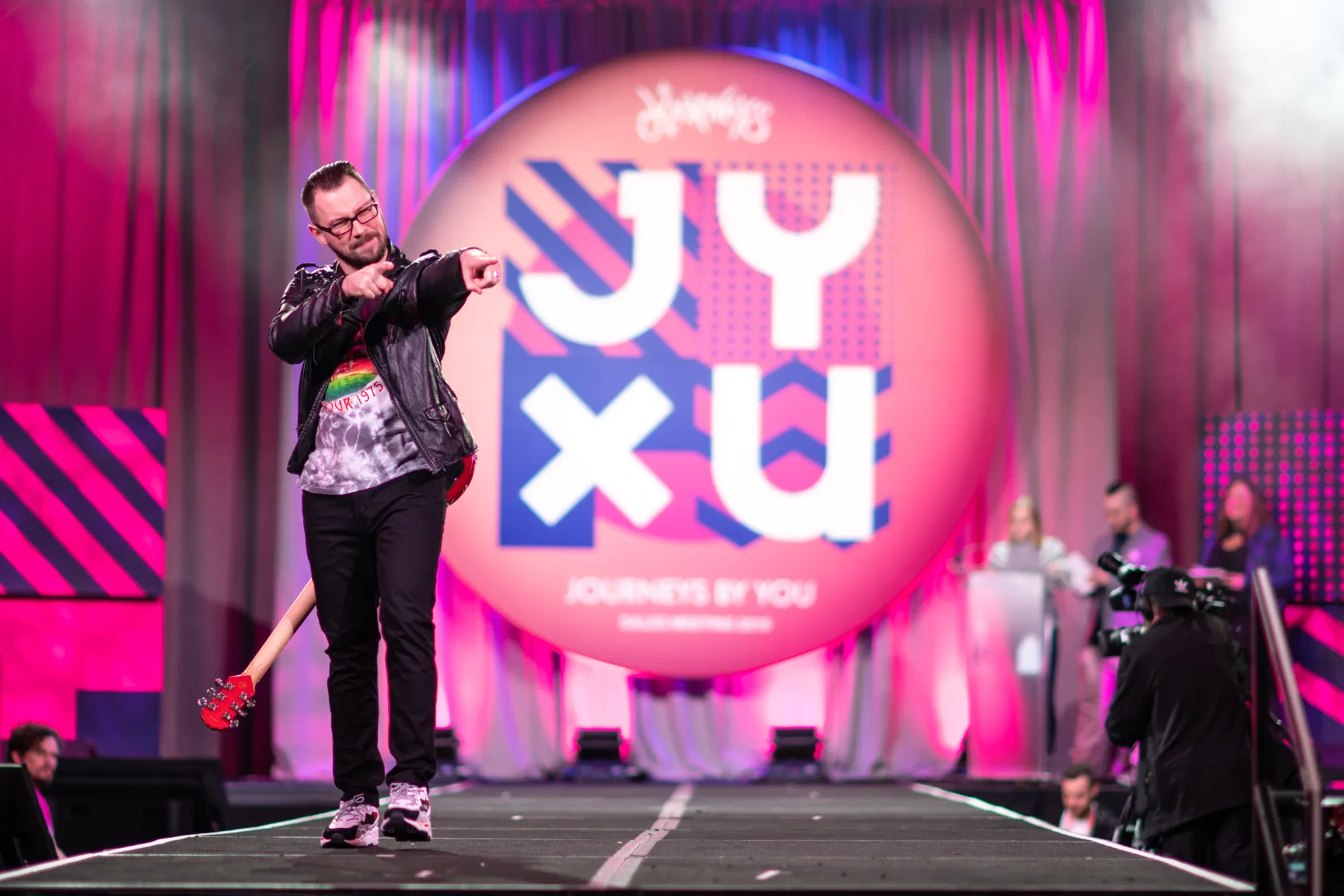 Genesco Journeys Model pointing down fashion runway