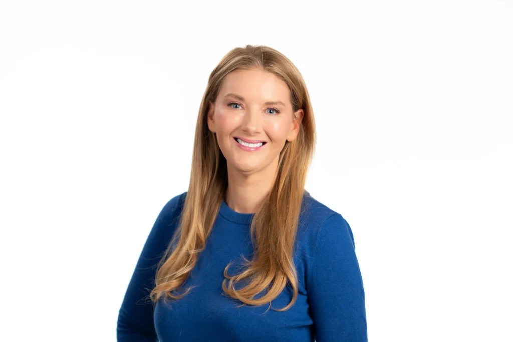 Professional headshot of a woman against a white background