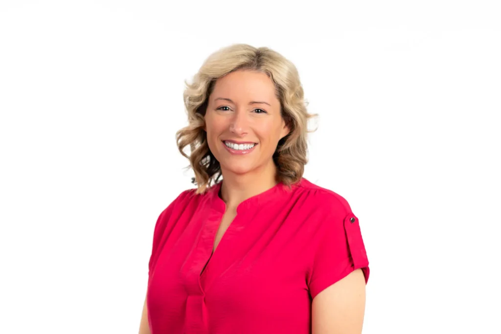 Professional headshot of a woman against a white background