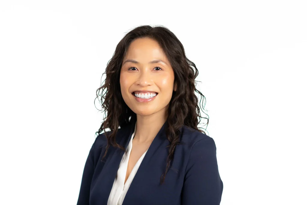 Professional headshot of a woman against a white background